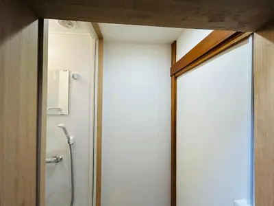 a bathroom with a shower and a glass door at 池袋 Cozy for 3-12guests 3BR House-3Showers &3Toilets in Tokyo