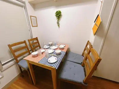 a dining room table with a checkered table and chairs at 池袋 Cozy for 3-12guests 3BR House-3Showers &3Toilets in Tokyo