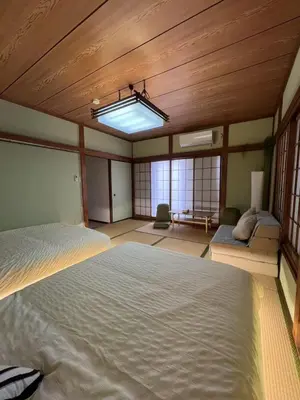 a large bedroom with a large bed and a ceiling at Takara\u8c4a\u5cf6\u5712201 NR0435 in Tokyo