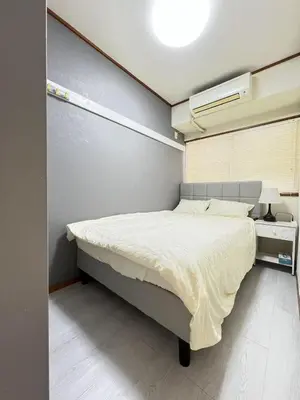 a bedroom with a large bed in a room at Takara\u8c4a\u5cf6\u5712201 NR0435 in Tokyo
