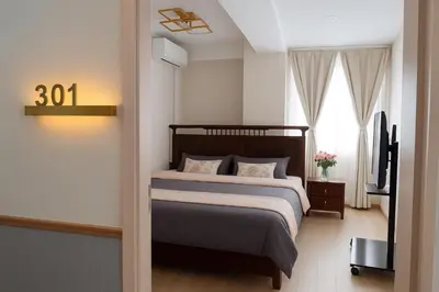 a bedroom with a bed and a television in it at \u685c\u306e\u5bbf in Tokyo