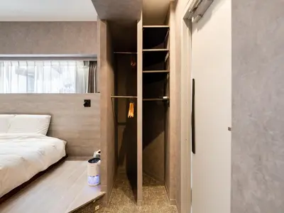 a small bedroom with a bed and a book shelf at Akihabara Sta 13min, Kanda Sta 10min,Ogawamachi 2min,Hotel Prime Inn Kanda, in Tokyo