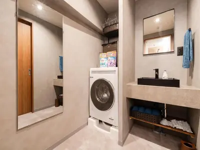 a bathroom with a washing machine and a sink at Akihabara Sta 13min, Kanda Sta 10min,Ogawamachi 2min,Hotel Prime Inn Kanda, in Tokyo