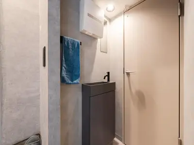 a small bathroom with a sink and a toilet at Akihabara Sta 13min, Kanda Sta 10min,Ogawamachi 2min,Hotel Prime Inn Kanda, in Tokyo