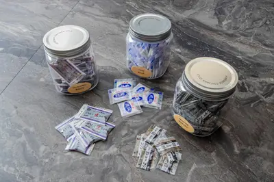 a group of jars sitting on the ground with money at Sakura in Tokyo
