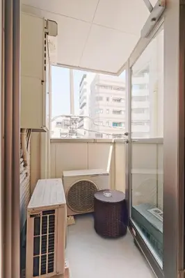 a room with a balcony with a fan and a window at V Close to Kikukawa sta 14 min to Akihabara in Tokyo