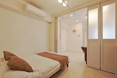 a bedroom with a bed and a walk in closet at V Close to Kikukawa sta 14 min to Akihabara in Tokyo