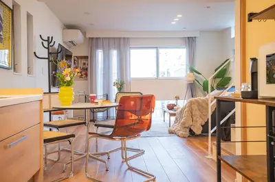 a kitchen and living room with a table and chairs at Ikebukuro Japandi Villa in Tokyo