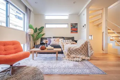 a living room with a couch and a coffee table at Ikebukuro Japandi Villa in Tokyo