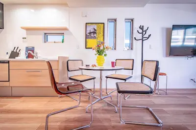 a kitchen with a table and chairs in a kitchen at Ikebukuro Japandi Villa in Tokyo