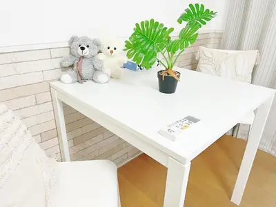 two teddy bears sitting on a white table at Takadanobaba RedH in Tokyo