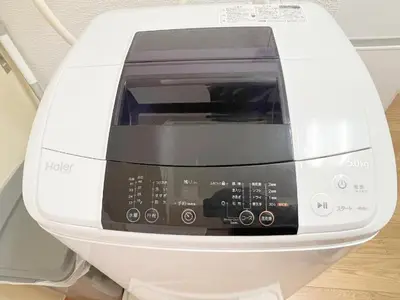 a white toaster oven sitting on top of a table at Takadanobaba RedH in Tokyo