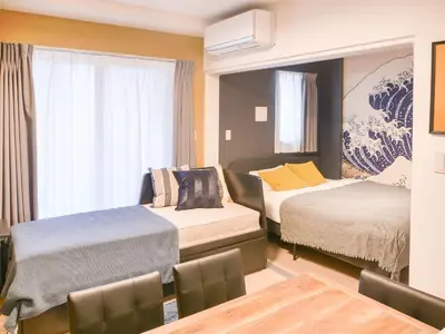 a hotel room with two beds and a window at Triphome Asakusa Alpha 2025 in Tokyo