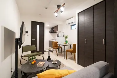 a living room with a couch and a table at \u30e1\u30be\u30f3\u30cf\u30a4\u30a6\u30a7\u30a4\u6c60\u888b in Tokyo