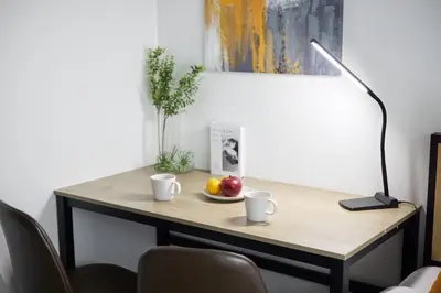 a desk with two cups and a plate of fruit on it at \u30e1\u30be\u30f3\u30cf\u30a4\u30a6\u30a7\u30a4\u6c60\u888b in Tokyo