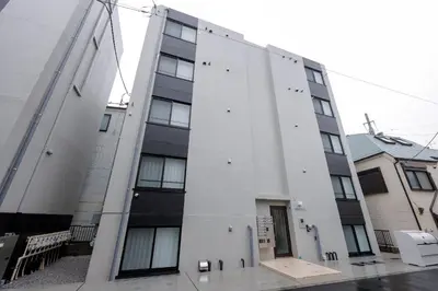 a white building with a door on the side of it at \u30ea\u30d0\u30c6\u30a3 in Tokyo
