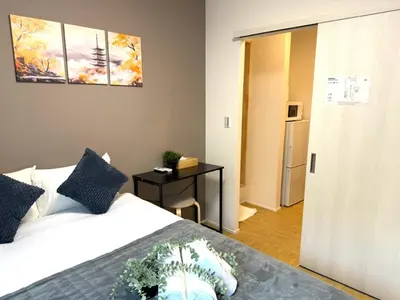 a bedroom with a bed with a plant on it at Ikebukuro Area 2 Units 2122 KamiikeApartment in Tokyo