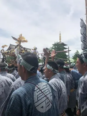 a group of men are standing in a group at Maison Okuasakusa in Tokyo