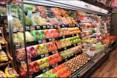 a produce section of a grocery store with fruits and vegetables at Maison Okuasakusa in Tokyo