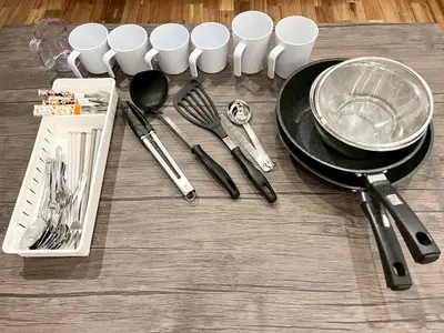 a table with a black plate and utensils on it at Yotsugi Hotel Asakusa Skytree in Tokyo