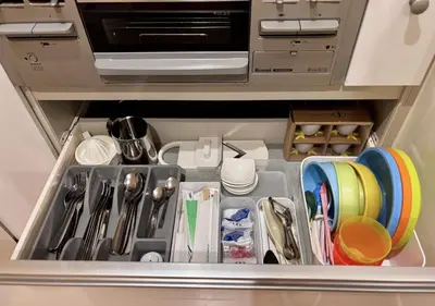 a drawer in a kitchen with utensils at Tokyo Bauhaus in Tokyo