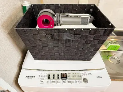 a basket on top of a washing machine at Tokyo Hakusan Louis Apartment near TOKYO DOME close to Yamanote Line in Tokyo