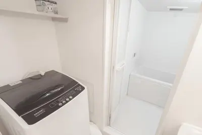 a refrigerator with a sink in the door of it at 1 minute from Higashi-Shinjuku Station Large living room in Tokyo