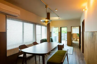 a living room with a dining room table and chairs at HOTEL RIN TOKYO - Private Townhouse - in Tokyo