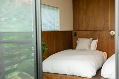 a bedroom with a white bed and a window at HOTEL RIN TOKYO - Private Townhouse - in Tokyo