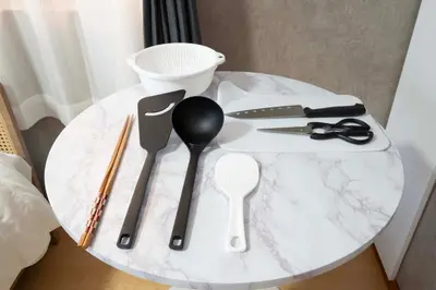 a white marble table with utensils on it at All Good Stay HEIWAJIMA in Tokyo