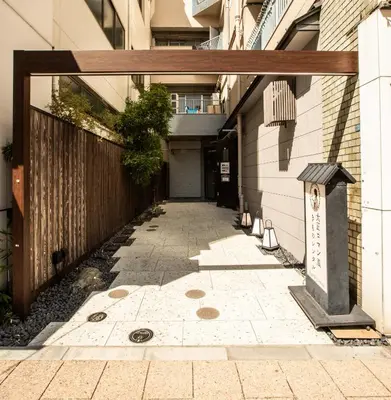 an alleyway in a building with a gate at Nestry Asakusa 403\u53f7\u5ba4 in Tokyo