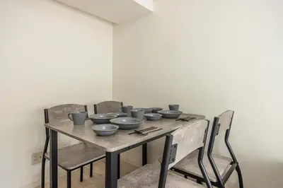 a wooden table with bowls on top of it at 20 minutes by Haneda Airport train 3-minute walk from Kamata Station Direct access to Tokyo, Yokohama, Ueno in Tokyo