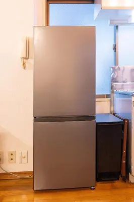 a stainless steel refrigerator in a kitchen at THE MULTIPLE Shinjuku WEST in Tokyo