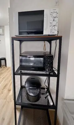 a black shelf with a microwave and a toaster oven at \u963f\u4e45\u6d25\u30cf\u30a4\u30c4201 in Tokyo