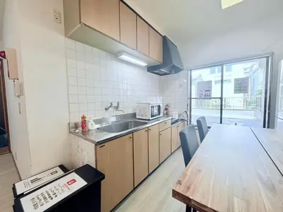 a kitchen with a table and a sink and a counter top at Terrace Stay Omori in Tokyo