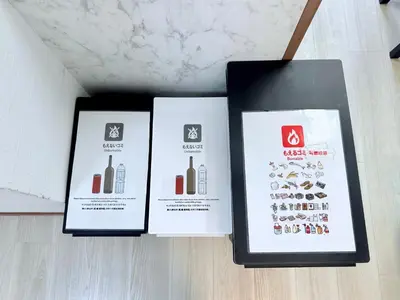 three boxes of books sitting on a floor at Terrace Stay Omori in Tokyo