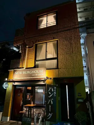a building with a sign for a new brunswick at Vista Stay Oshiage in Tokyo