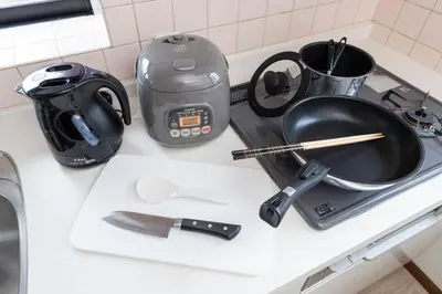 a kitchen counter with a frying pan and a tea kettle at Vista Stay Oshiage in Tokyo