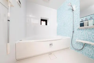 a bathroom with a shower and a white tub at Vista Stay Oshiage in Tokyo