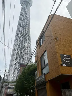 a view of the eiffel tower from the street at Vista Stay Oshiage in Tokyo