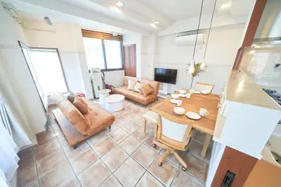 a living room with a table and a couch at Jazz Building 4F5F - Vacation STAY 28953v in Tokyo