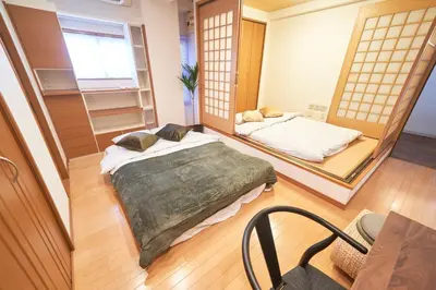 two beds in a room with a mirror at Jazz Building 4F5F - Vacation STAY 28953v in Tokyo