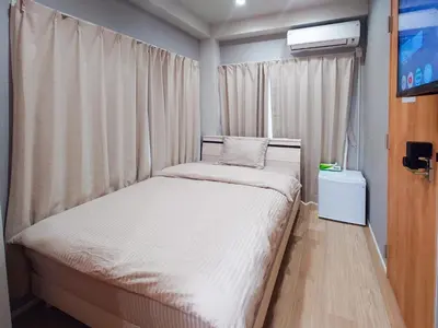 a small bedroom with a bed and a tv at Hotel Yado SK Shinkoiwa - Vacation STAY 17432v in Tokyo