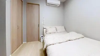 a small room with two beds and a closet at Hotel Yado SK Shinkoiwa - Vacation STAY 17432v in Tokyo