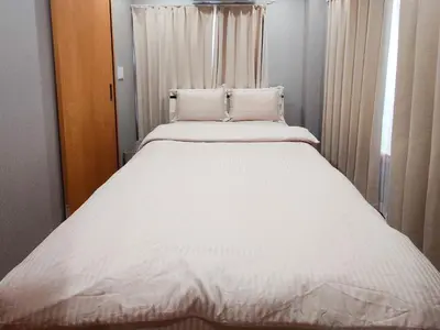a large white bed in a small room at Hotel Yado SK Shinkoiwa - Vacation STAY 17432v in Tokyo