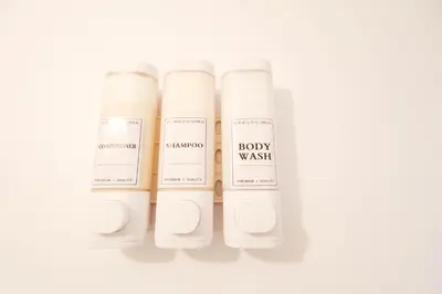 a group of four white bottles of body wash at Shinjuku 2bed rooms apartment#2室1厅#智能马桶#高速无限制网路1 in Tokyo