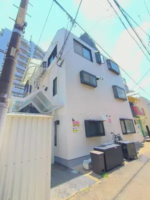 a white building with a fence in front of it at Shinjuku 2bed rooms apartment#2室1厅#智能马桶#高速无限制网路1 in Tokyo