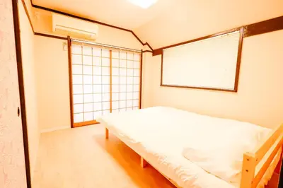 a small bedroom with a bed and a window at Shinjuku 4bed rooms apartment#4室2厅2浴室2卫生间#智能马桶#高速无限制网路3&1 in Tokyo