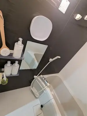 a bathroom with a sink and a mirror and a toilet at 15min from Haneda Airport Cozy for 3 in Tokyo