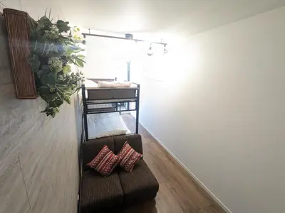 two pillows sitting on a couch in a room at 15min from Haneda Airport Cozy for 3 in Tokyo